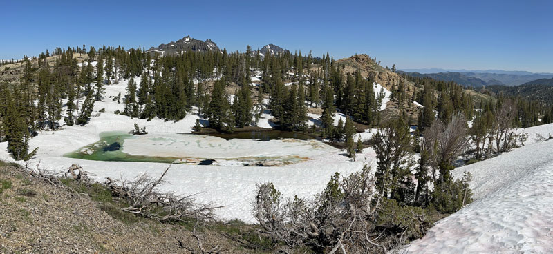 A panoramic view of the partially frozen Dorothy Lake.