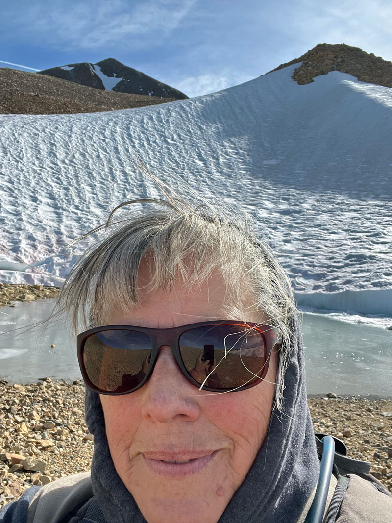 Michele taking a selfie in from of Jack's "Glacier" and Dunderberg Peak.